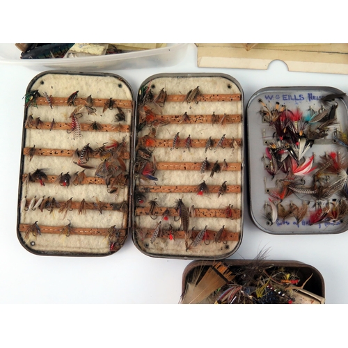 1594 - A collection of assorted salmon, sea  trout ant trout flies, contained in fly boxes and loose.