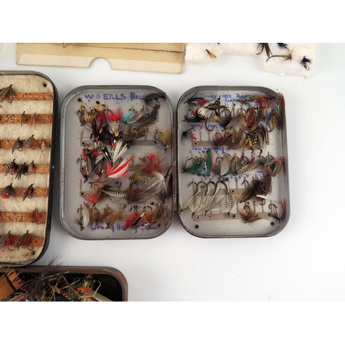 1594 - A collection of assorted salmon, sea  trout ant trout flies, contained in fly boxes and loose.