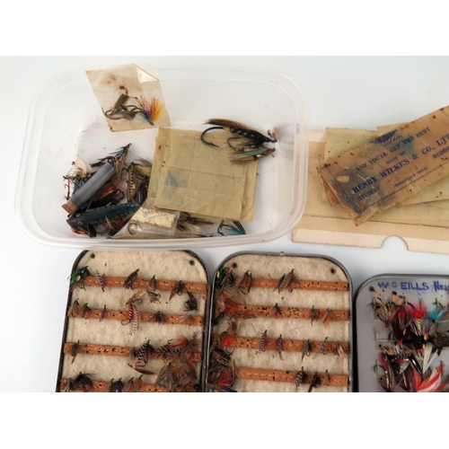 1594 - A collection of assorted salmon, sea  trout ant trout flies, contained in fly boxes and loose.