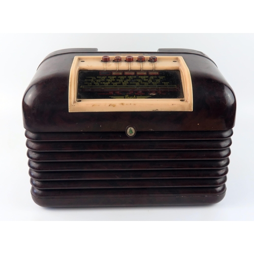 1600 - A Bush brown and white Bakelite cased mains radio. 
(sold as a collector's item _ not to be used wit... 