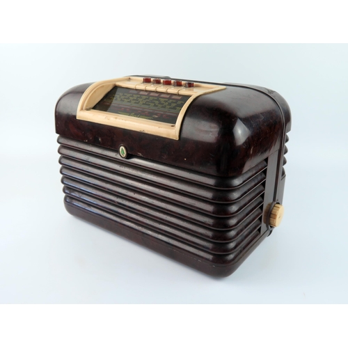 1600 - A Bush brown and white Bakelite cased mains radio. 
(sold as a collector's item _ not to be used wit... 