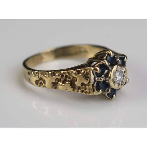 161 - A 9ct Gold, Sapphire and Diamond Cluster Ring, 11mm head, size N.5, 3.4g