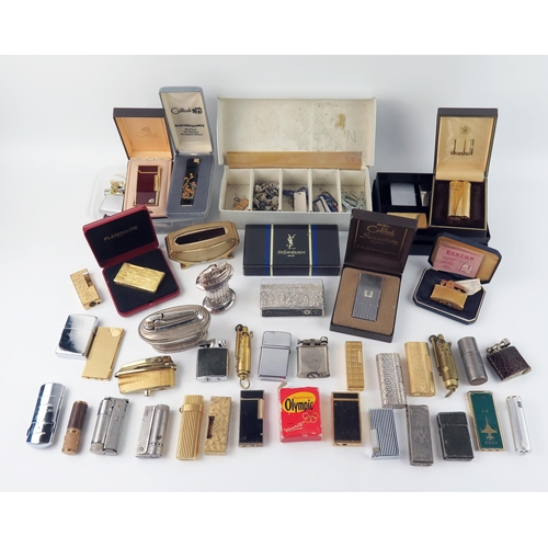 1617 - A Dunhill gold plated cigarette lighter in a fitted case, together with assorted other cigarette lig... 