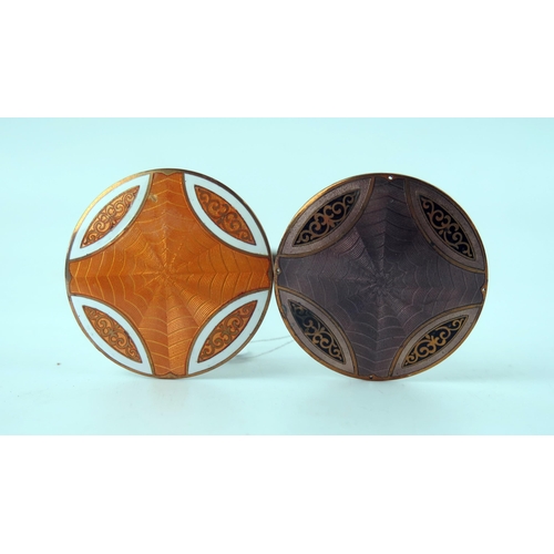 1618 - Two copper and enamel hat pins, the circular terminals with geometric pattern decoration. (2).