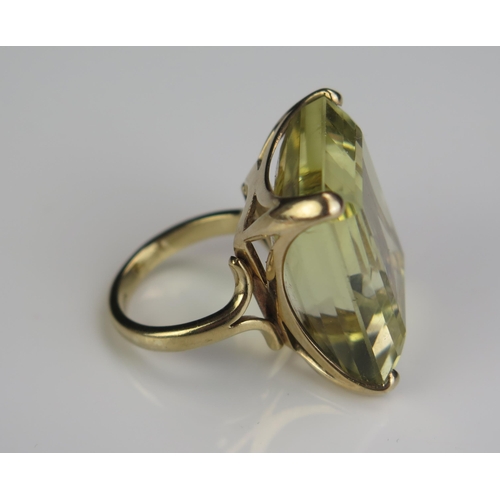 163 - A 9ct Gold and Citrine Dress Ring, c. 25.5x21.5x12mm stone, size O.5, 18.3g