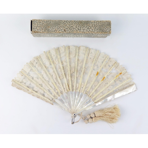 1634 - An Edwardian fan with lace work leaf mounted on mother-of-pearl sticks and guards, 19cm long.