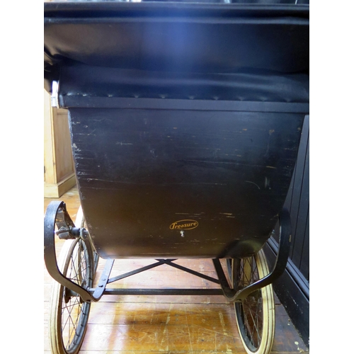 1650 - Treasure Cot Co. London, an early 20th century painted wood and canvas pram,  with black and lined c... 