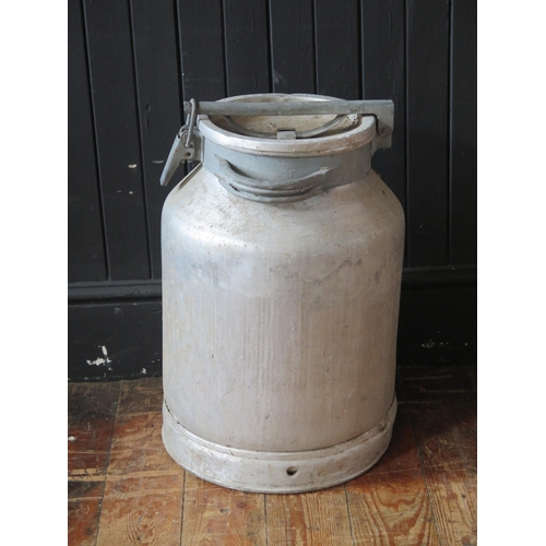 1651 - An aluminium milk churn.54cm high.