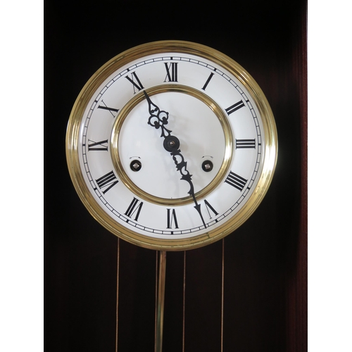 1656 - A mahogany Vienna style wall clock, with 18cm Roman dial, , the movement with bitalic pendulum, over... 