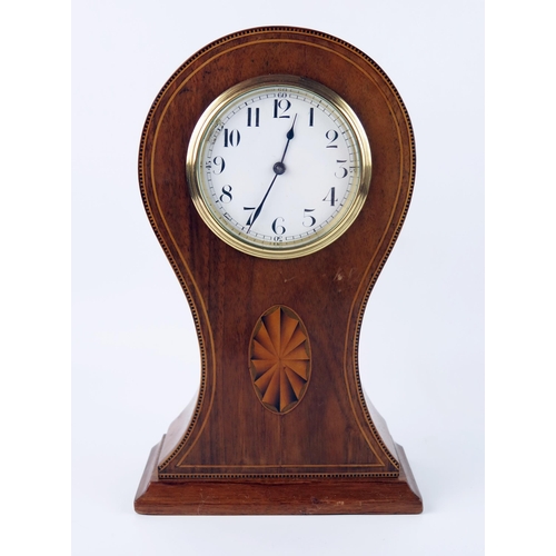 1658 - An Edwardian mahogany and inlaid balloon mantel timepiece, with 9cm Arabic dial, the circular moveme... 