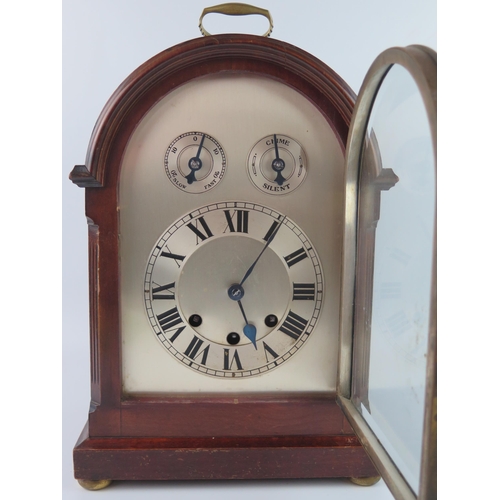 1659 - A mahogany cased director's style bracket clock, with arched silvered Roman dial with regulation and... 