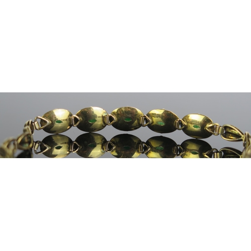 166 - A Jadeite Bracelet set with five 10.5x7mm oval cuts in an unmarked gold setting, c. 6.5