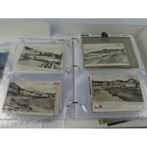 1709 - Three albums containing Edwardian and later postcards, includes shipping, aircraft, topographical, h... 