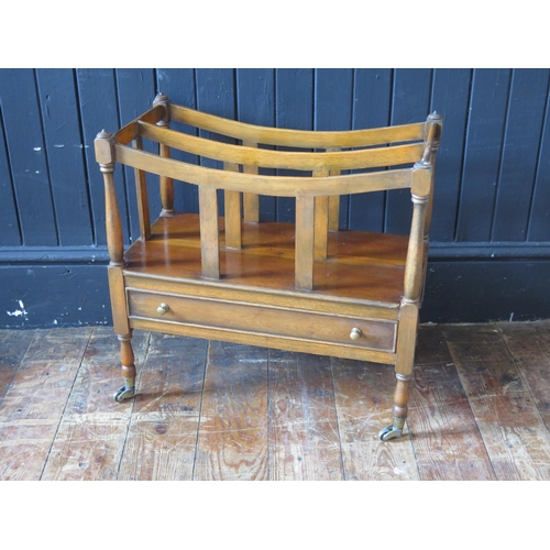 1775 - A reproduction yew wood two-division Canterbury, with single drawer to the base, on turned legs and ... 