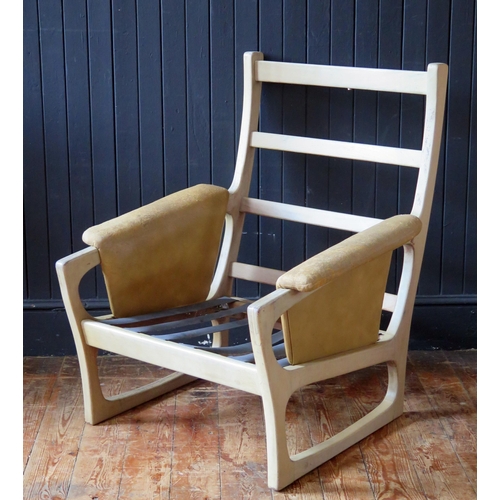 1783 - A Folke Ohlsson for Gimson & Slater a teak chair frame, with padded arm rests.