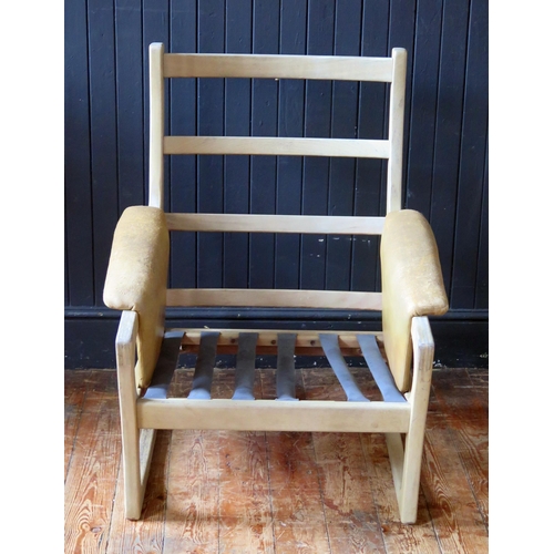 1783 - A Folke Ohlsson for Gimson & Slater a teak chair frame, with padded arm rests.