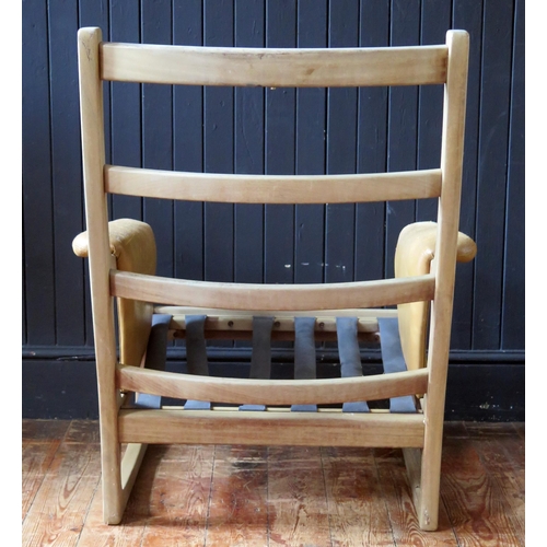 1783 - A Folke Ohlsson for Gimson & Slater a teak chair frame, with padded arm rests.