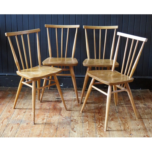 1784 - A set of four 1950's Ercol blonde stick-back chairs, with solid seats and turned legs.