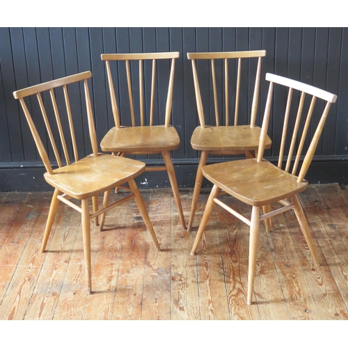 1784 - A set of four 1950's Ercol blonde stick-back chairs, with solid seats and turned legs.