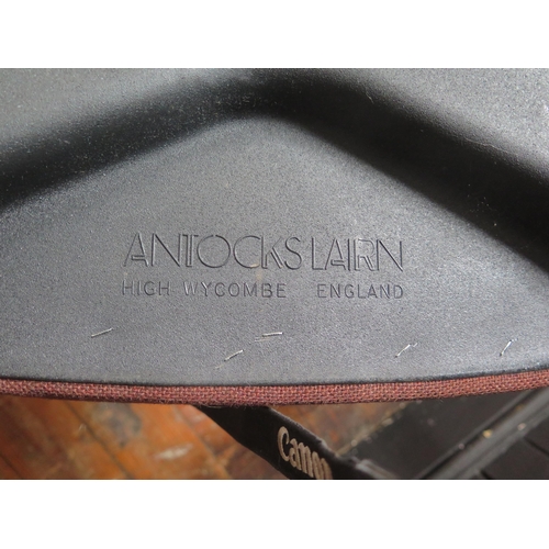 1786 - A set of four Antocks Lairn stainless steel and teak elbow chairs, with padded backs and seats, labe... 