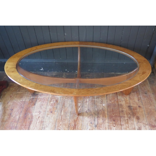 1787 - A 1970's G-Plan Astro oval teak coffee table, with inset glass top, 122cm long, together with a Nath... 