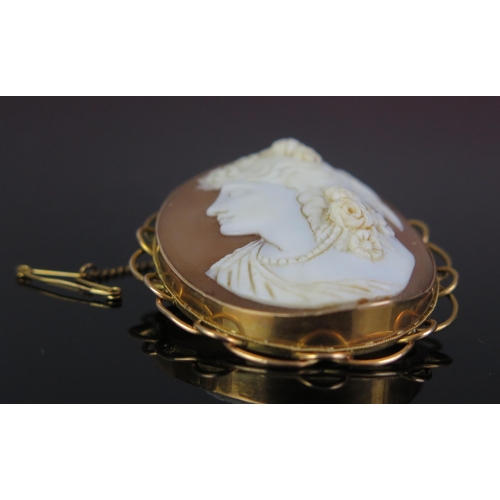 63 - A 15ct Gold Mounted Shell Cameo Brooch decorated with the bust of a lady in profile, with safety cha... 