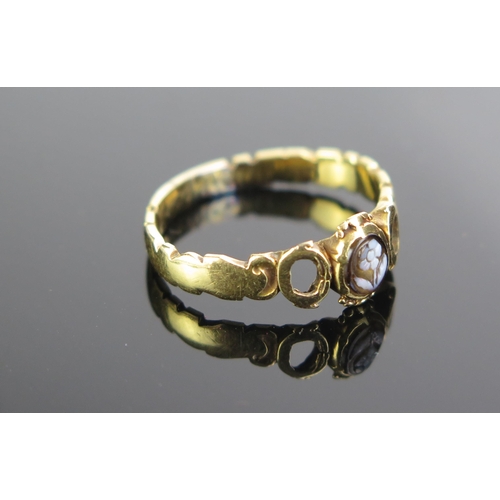 64 - An Unmarked Gold and Hardstone Forget Me Not Ring, engraved inside C M Cookson, size L.5, 2.6g. Two ... 