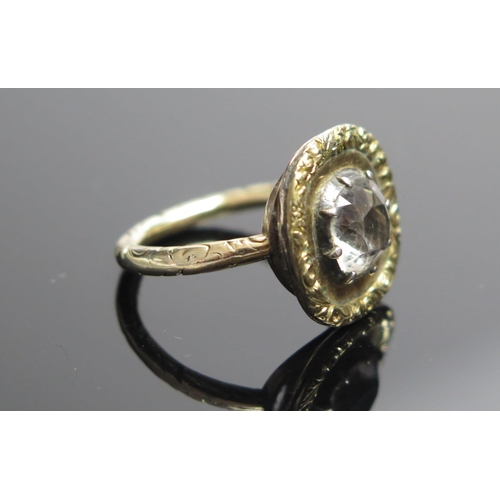 68 - A Georgian Unmarked Gold and Foil Backed White Hardstone Ring with chased foliate decoration to the ... 