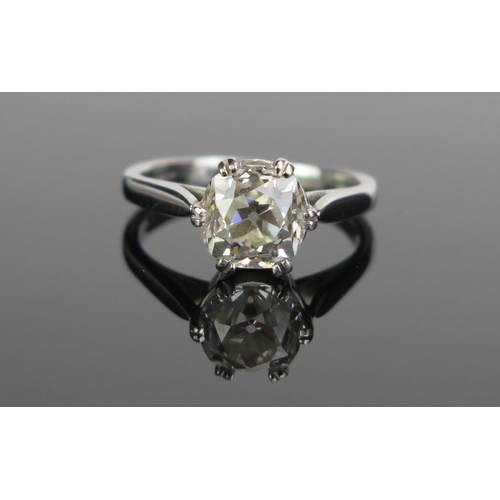 72 - A Platinum and Old Cut Diamond Solitaire Ring in a modern .950 setting, size L.25.  Sold with insura...