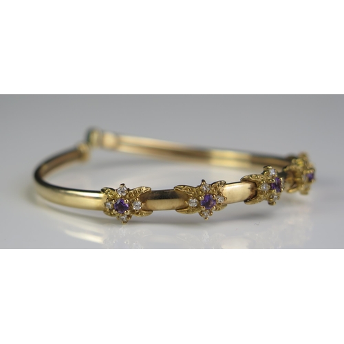 83 - A 9ct Gold, Amethyst and White Stone Torque Bangle, 8.7g