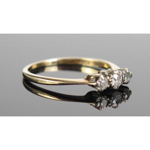 89 - A Three Stone Diamond Ring in an unmarked high carat gold setting, largest stone c. 3.5mm, size P.5,... 