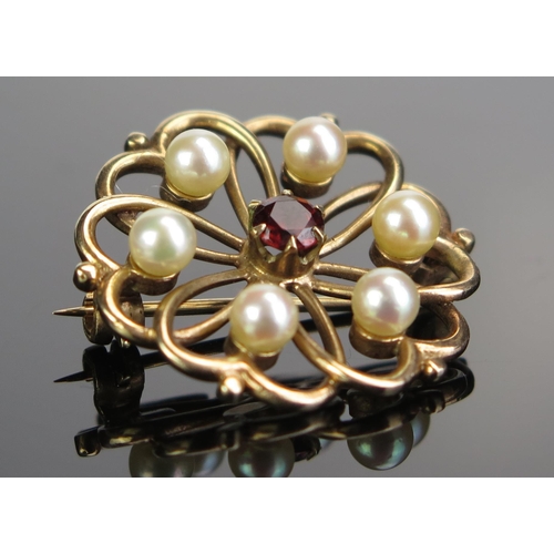 96 - A 9ct Gold, untested Pearl and Garnet Brooch, c. 27mm diam., 5,2g