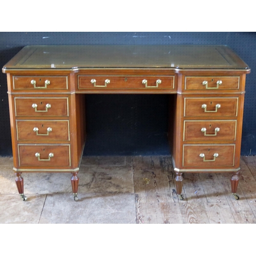 1781 - A reproduction mahogany and brass knee hole desk of rectangular outline the inverted breakfront with... 