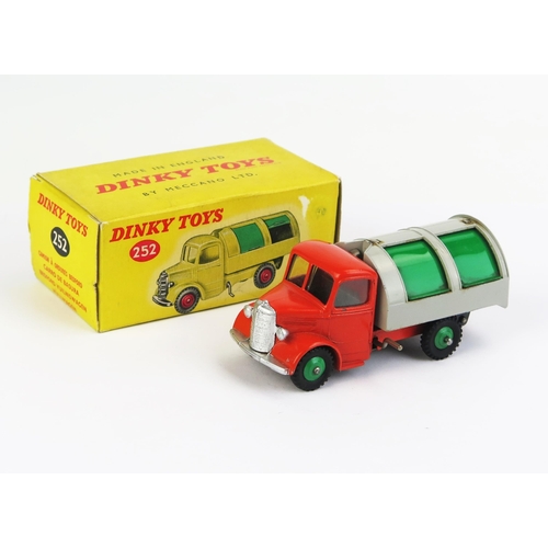 Dinky 252 Bedford Refuse Wagon - bright orange cab and chassis, light grey back, green plastic side shutters and metal rear shutter, window glazing, silver grille, bumper and headlights, green ridged hubs, gloss black base - near mint in excellent box but missing some print to one end