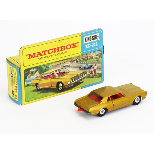 1217 - Matchbox King Size K21 Mercury Cougar - gold, red interior and tow hook, unpainted base, chrome hubs... 