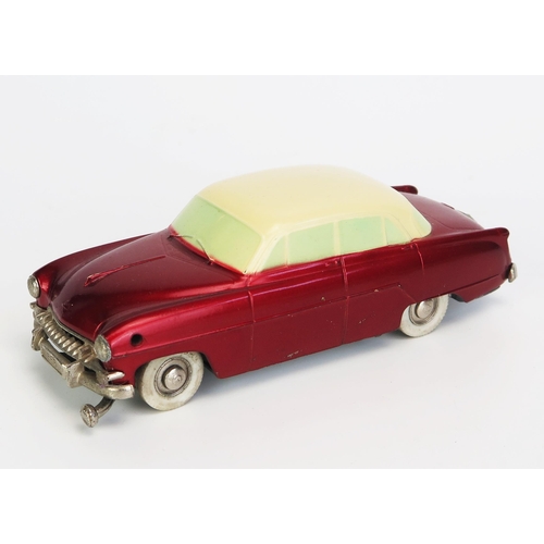 1230 - Prameta (Germany) Opel 555 Kapitan clockwork car - two-tone metallic red/cream, pale blue painted wi... 