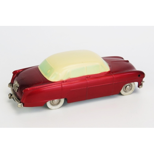 1230 - Prameta (Germany) Opel 555 Kapitan clockwork car - two-tone metallic red/cream, pale blue painted wi... 