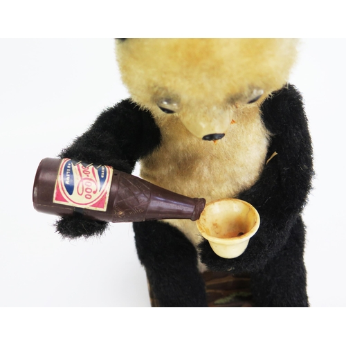 1270 - Alps (Japan) Battery Operated Plush Panda Pouring Cola/Beer sitting on Tinplate Lithographed Log - e... 