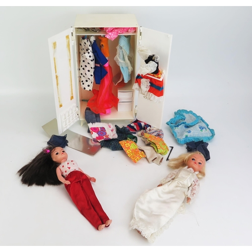 1297 - Two Sindy Pedigree Dolls, 033055X (excellent) & 033050X (altered hair) and wardrobe filled with clot... 