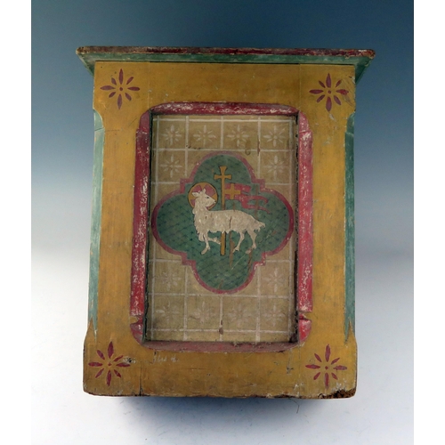 1777 - A 19th century pine and polychrome decorated lectern, the front panel depicting the Lamb of God with... 