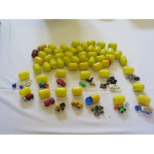 1297C - 54 Vintage Kinder Egg Toys including vehicles, figures etc. all in cases