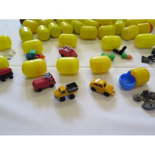 1297C - 54 Vintage Kinder Egg Toys including vehicles, figures etc. all in cases