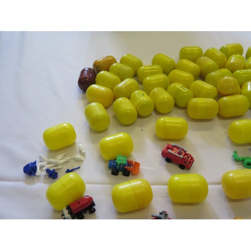 1297C - 54 Vintage Kinder Egg Toys including vehicles, figures etc. all in cases