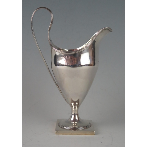 10 - A George III silver cream jug maker Luke Proctor & Co,  Sheffield, 1794, of helmet-shaped outline wi... 