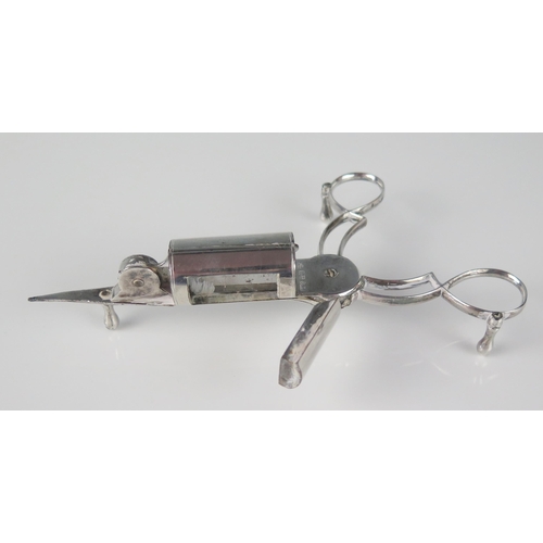 20 - A pair of silver plated candle snuffers with scissor action and spring loaded wick trimmer, raised o... 