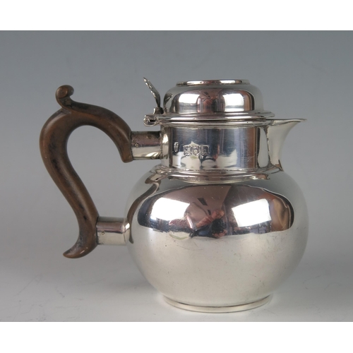 36 - An Edward VII silver hot water jug, maker Charles Stuart Harris, London, 1903, of globular form with... 