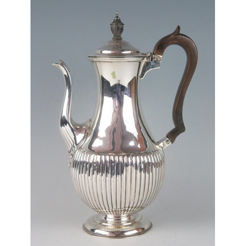 54 - A Victorian silver coffee pot, maker William Hutton & Sons, London, 1881, of baluster form, with hal... 