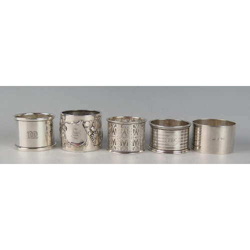 64 - A collection of five assorted silver napkin rings, various makers and dates, total weight of silver,... 