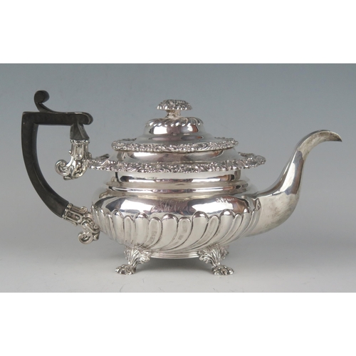 69 - A George IV silver teapot, maker Waterhouse & Ryland, Birmingham, 1824, monogrammed, with moulded fl... 