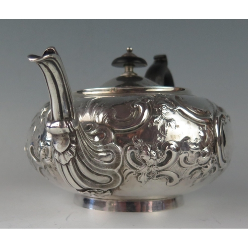 8 - A George III silver teapot, maker Robert Garrard I, London, 1812, crested, of squat circular form, w... 
